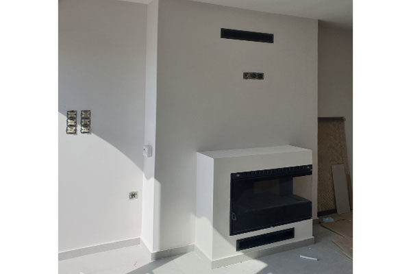 fireplace created by the placement of energy save kasette sener corner superkamin photo