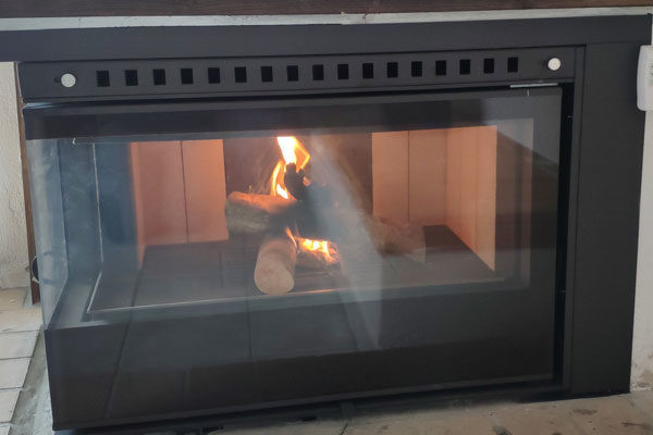 fireplace after the installation of an energy save cassette superkamin insert sener corner detail