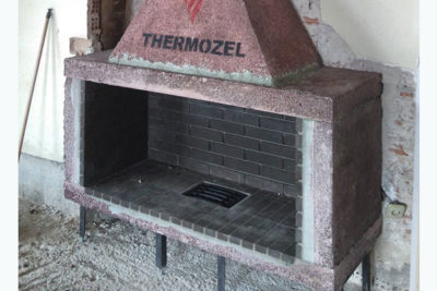 traditional fireplace with black brick interior therrmozel