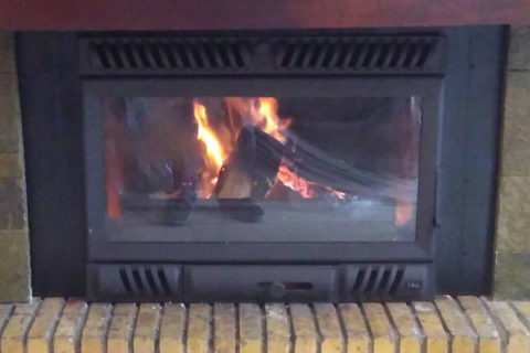 fireplace after the placement of energy save kasette invicta insert  s close up