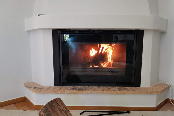 fireplace after the placement of energy save kasette grand angle invicta in a corner